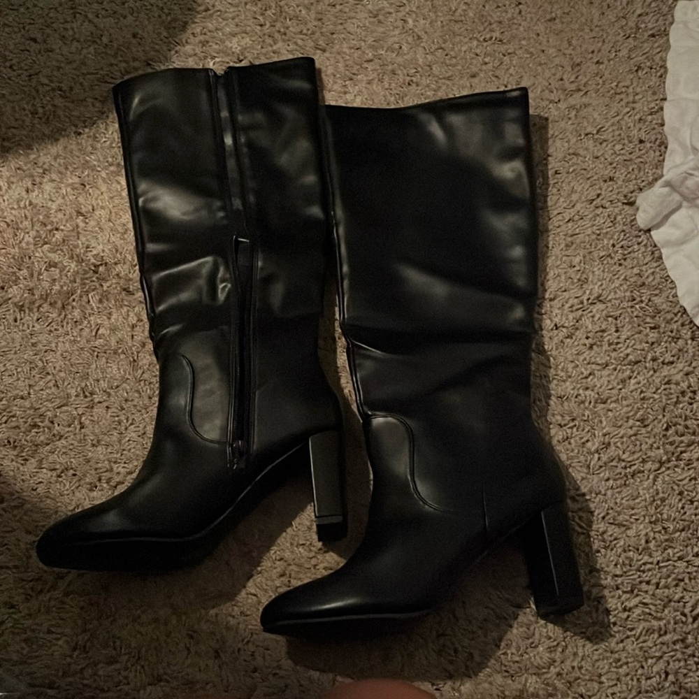 Brand new/Never been worn black knee high faux leather boot.